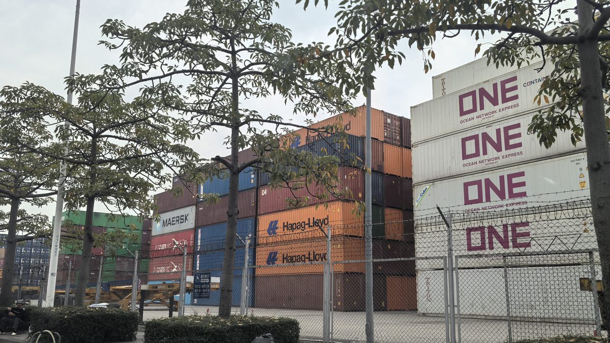 Groupage cargo on pallets being loaded into a consolidated container at a Shenzhen freight station for an LCL sailing to Vancouver and Toronto, Canada