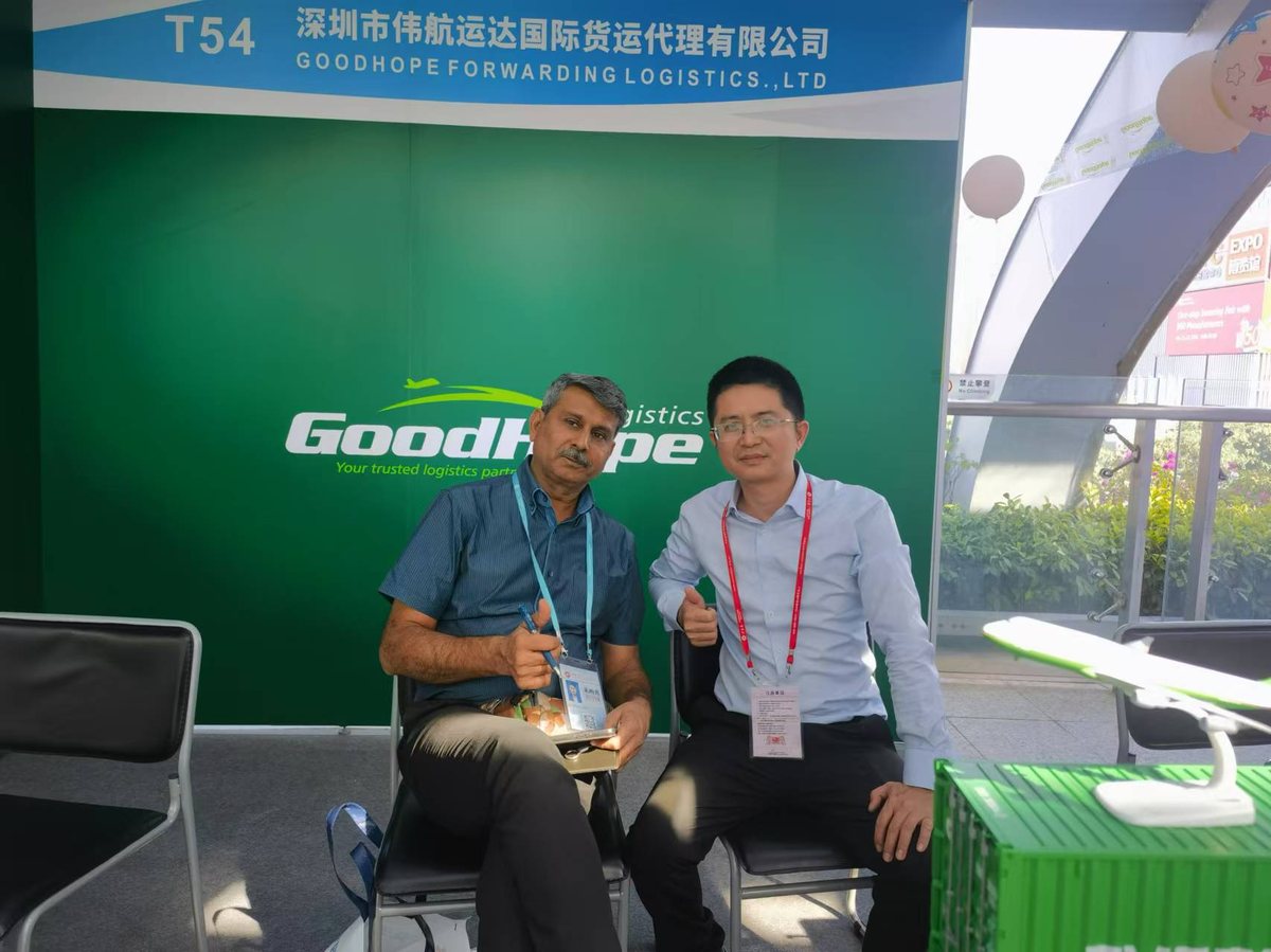 Goodhope Logistics (China) Limited at booth T54 of the 136th Canton Fair, representatives with visiting buyers
