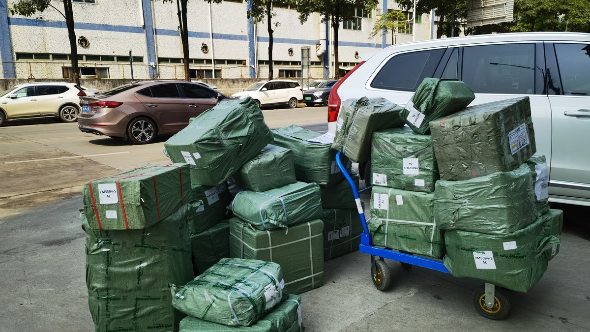 Parcels and trolley at the Goodhope Freight consolidation warehouse for DHL dispatch