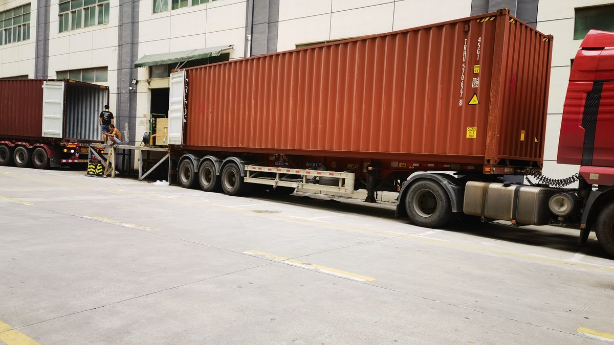 Containers stacked at a warehouse yard awaiting customs clearance for Indonesia