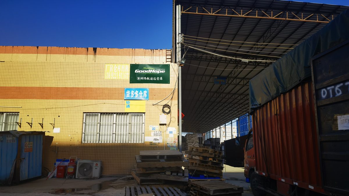 Groupage cargo from several Chinese suppliers consolidated and labelled at a freight station before loading into one LCL container