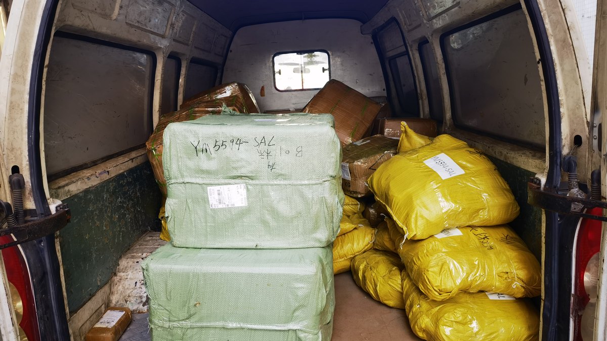Van loaded with parcels prepared for dispatch to New Zealand
