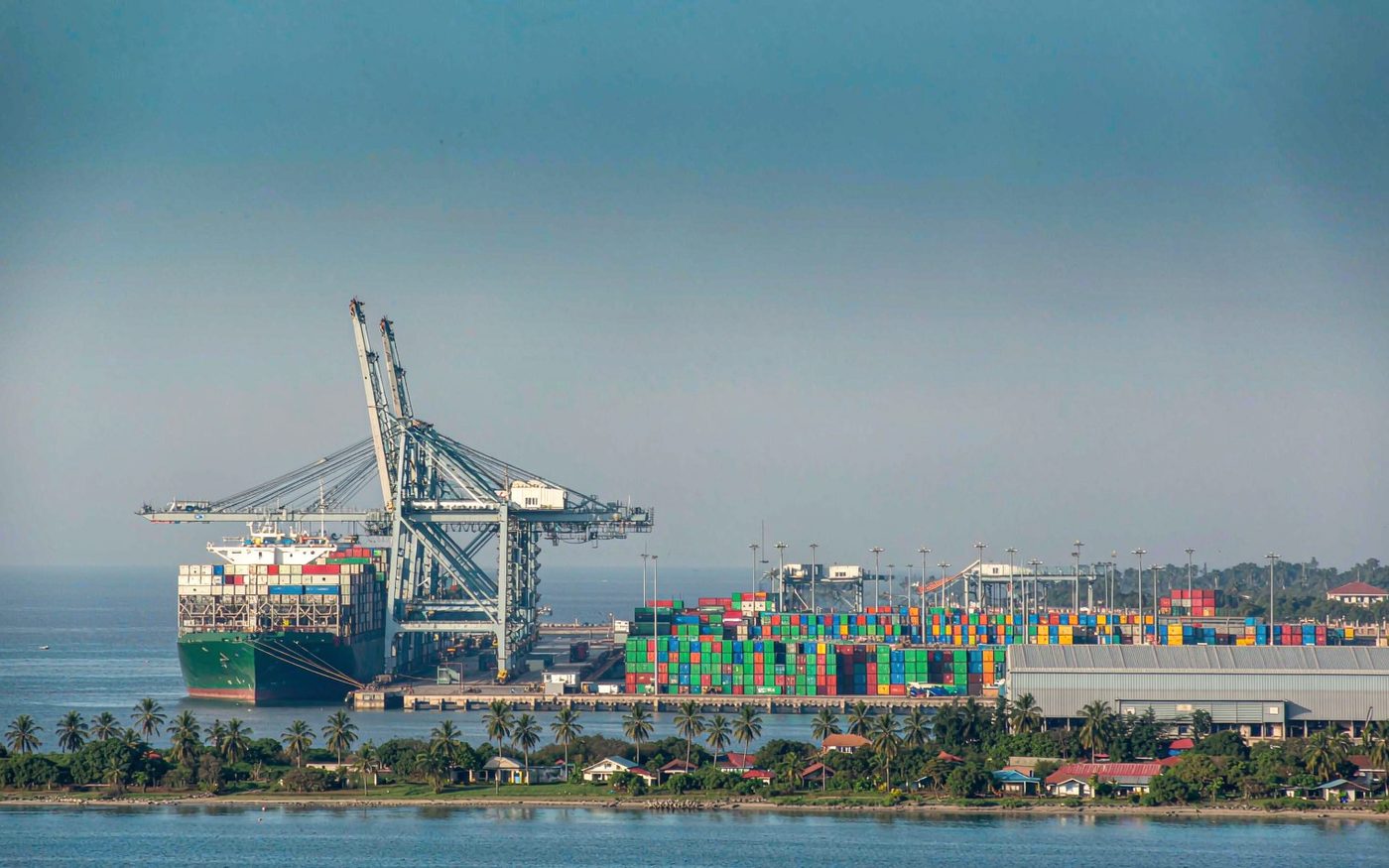 Container terminal at the Port of Abidjan in Côte d'Ivoire with gantry cranes and stacked shipping containers
