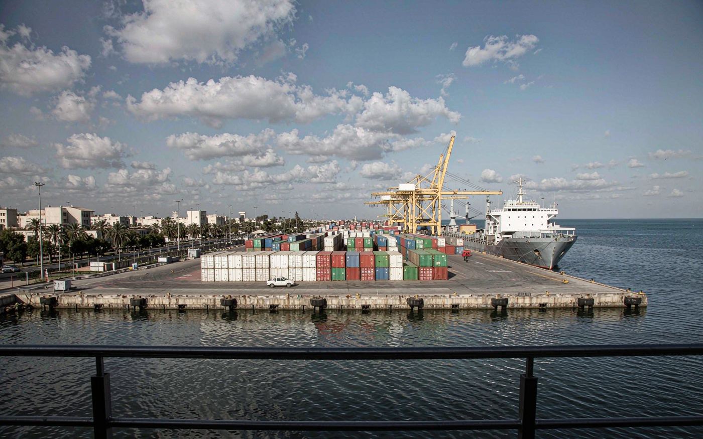 Container port of Tripoli in Libya with gantry cranes, stacked containers and Mediterranean waterfront