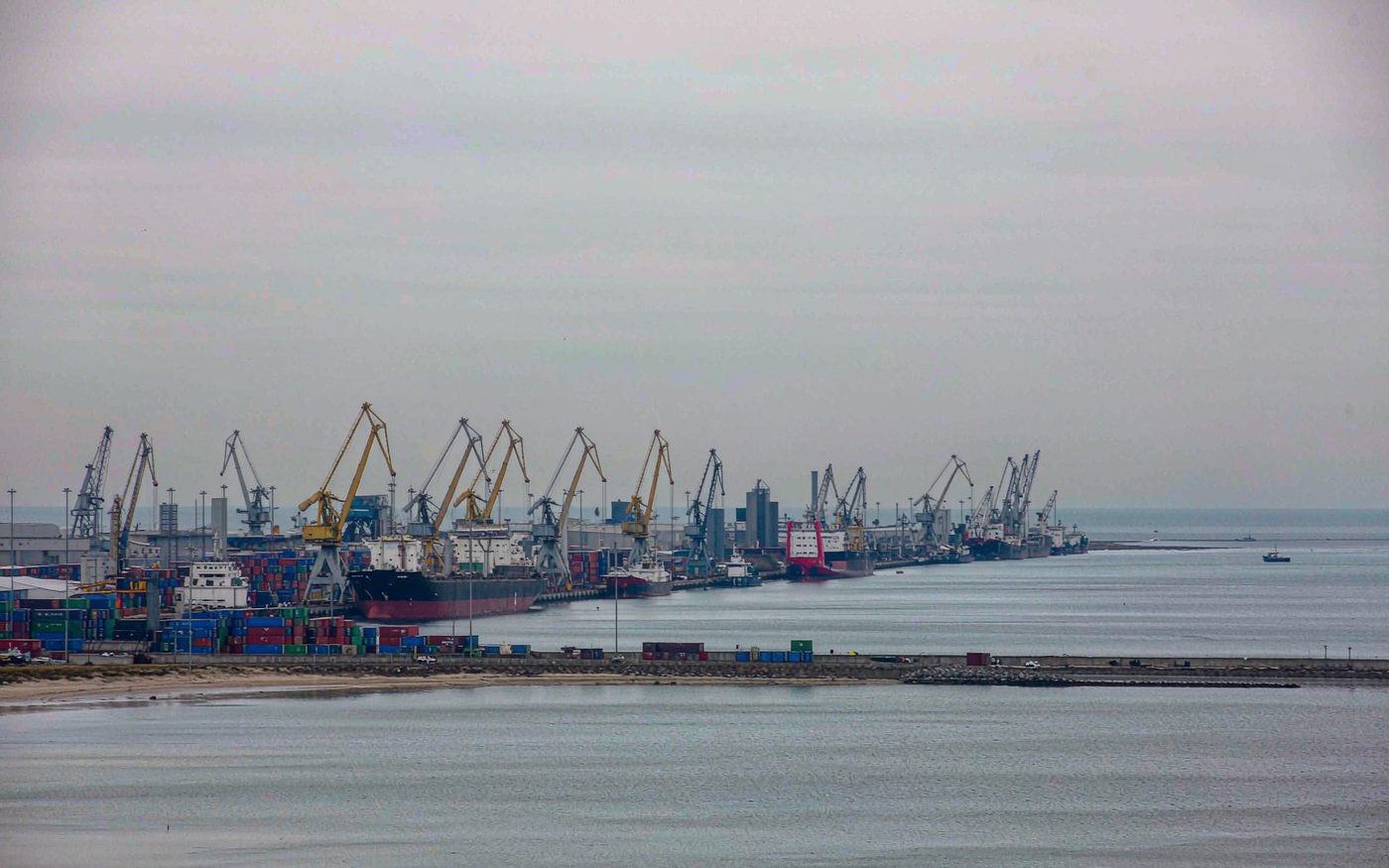 Container terminal and a berthed cargo vessel at the port of Klaipeda in Lithuania
