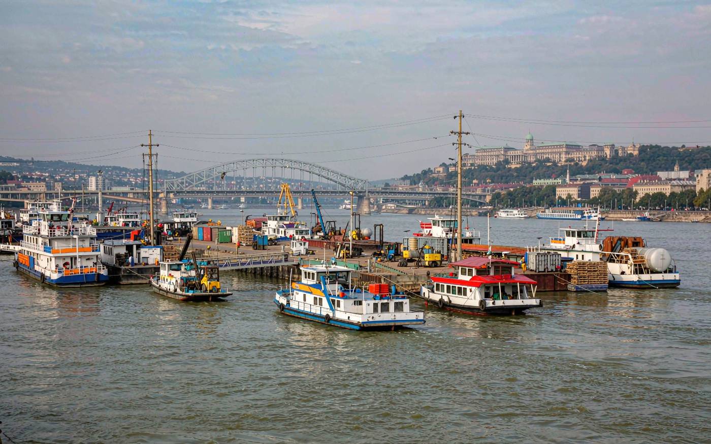River port on the Danube with cargo vessels and container handling cranes