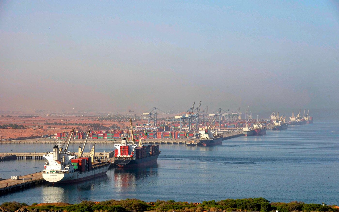 Harbour view of Port Sudan on the Red Sea with cargo vessels and container stacks at the quay