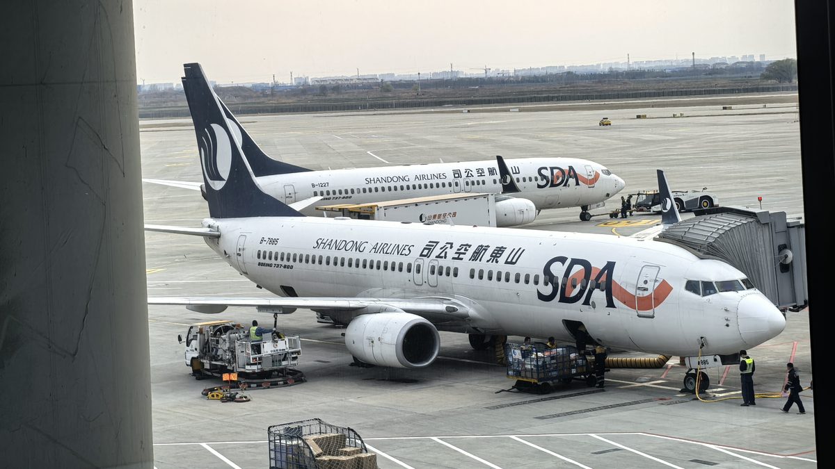 Cargo aircraft on the apron with a loader at a Chinese airport &mdash; air freight from Hong Kong to Chicago O'Hare