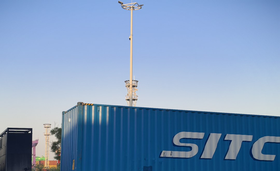 Shipping container loaded with dangerous goods cargo at a Chinese port, ready for ocean transport to the United States under IMDG Code