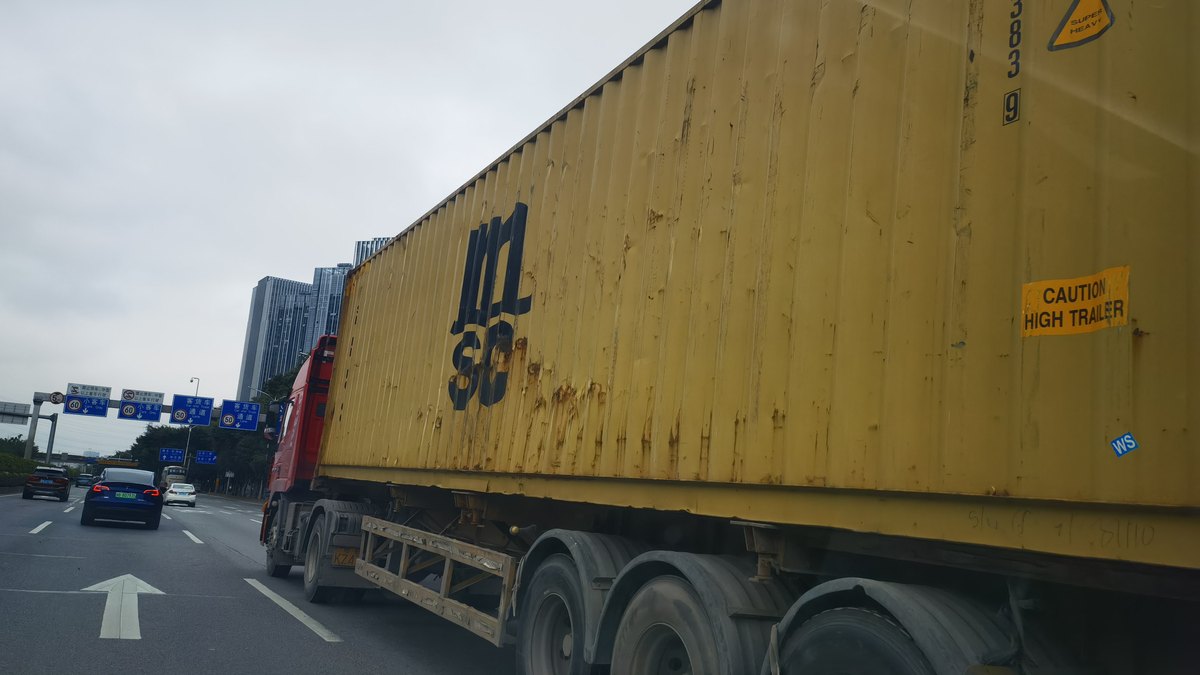 Container trucks on the highway carrying export cargo to Singapore and Malaysia