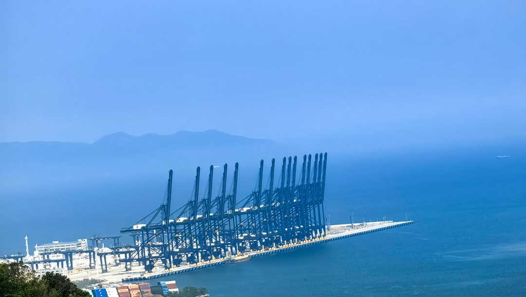 distant view of container cranes along a terminal